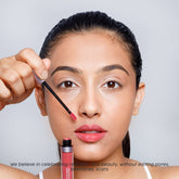 Female model applying Dawn To Dawn Super Stay Liquid Matte Lipstick - Pink Sugar shade