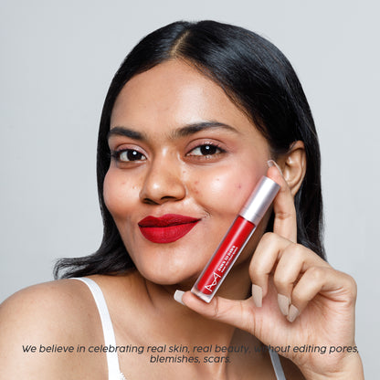 Brown-Skinned Model Applying Dawn To Dawn Super Stay Liquid Matte Lipstick in apple candy shade