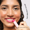 Model applying Jam Packed Tinted Lip Superfood in Pink Lemonade shade